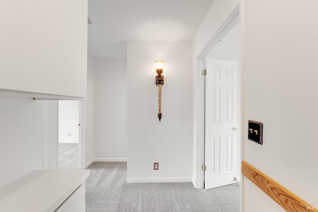 hallway with light colored carpet