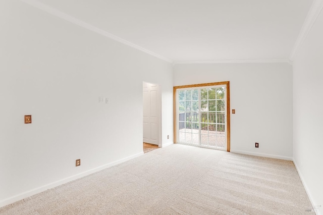 empty room featuring light carpet and ornamental molding