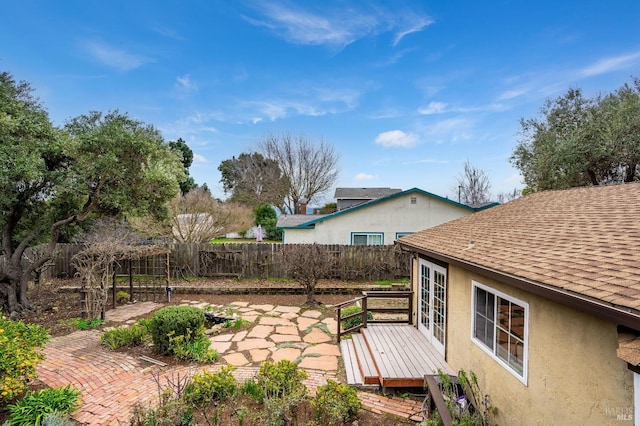 view of yard featuring a patio area and french doors