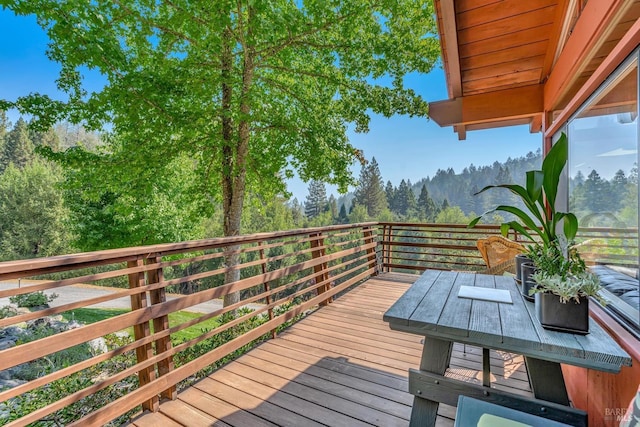 deck featuring a wooded view