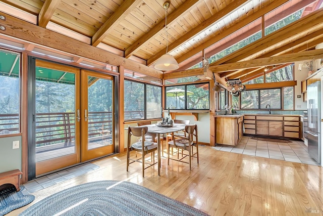 sunroom / solarium featuring sink, lofted ceiling with beams, french doors, and wooden ceiling