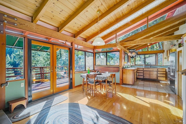 sunroom featuring wooden ceiling, french doors, lofted ceiling with beams, and a sink