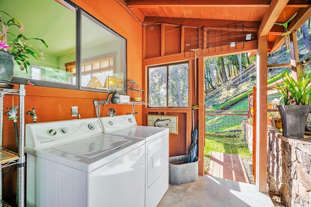 laundry room with washer and dryer and wooden ceiling