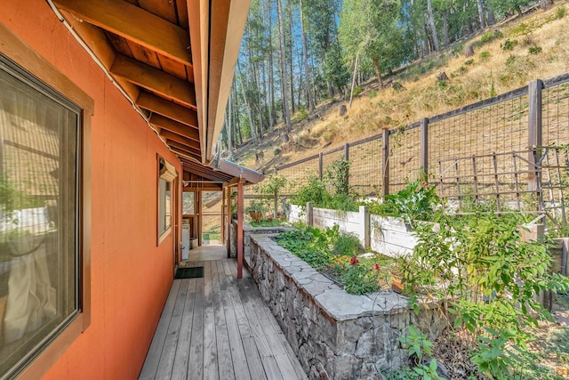 wooden deck featuring fence