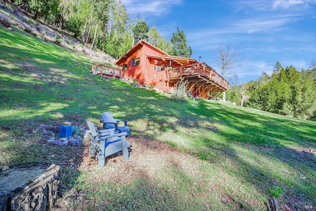 view of yard featuring a wooden deck