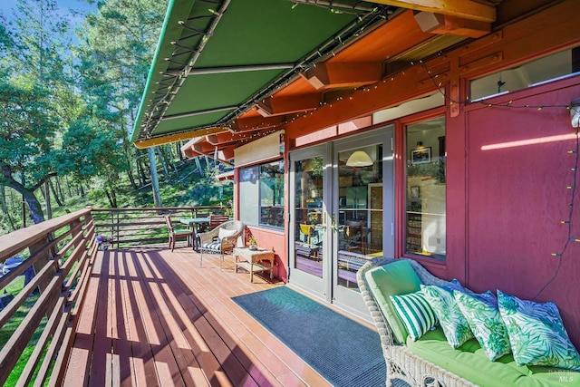 wooden deck featuring french doors