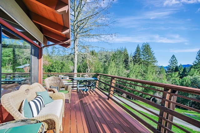 deck featuring a wooded view