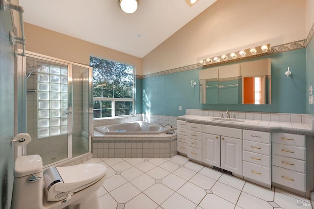 full bathroom with toilet, vanity, vaulted ceiling, tile patterned floors, and independent shower and bath