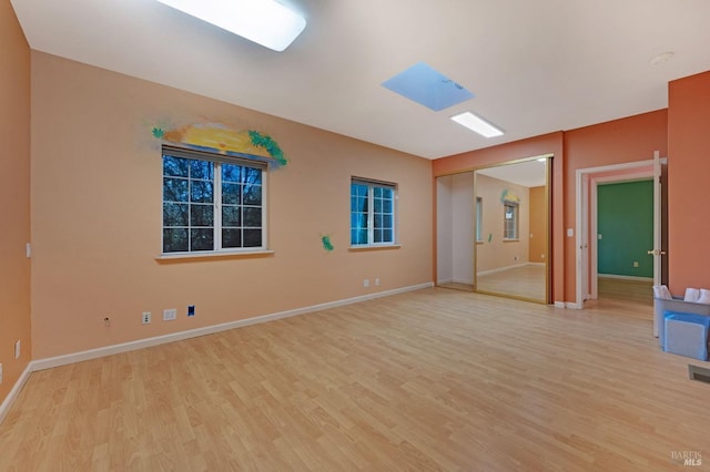 spare room with light hardwood / wood-style floors