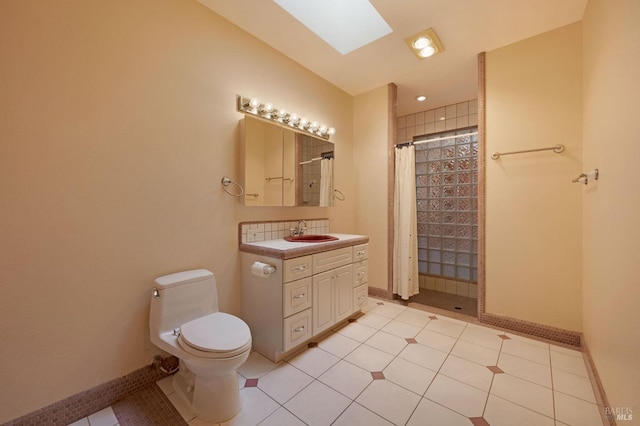 bathroom with tile patterned flooring, a skylight, and walk in shower