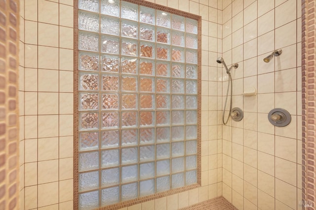 bathroom with a tile shower