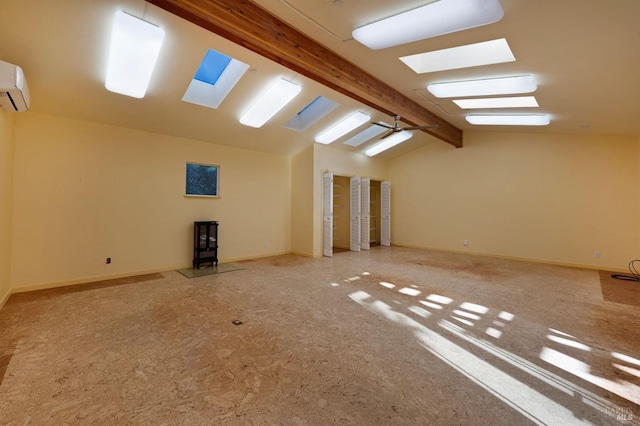 additional living space with ceiling fan, carpet, an AC wall unit, and vaulted ceiling with beams