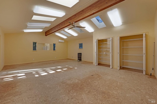 additional living space featuring ceiling fan, built in features, and lofted ceiling with beams