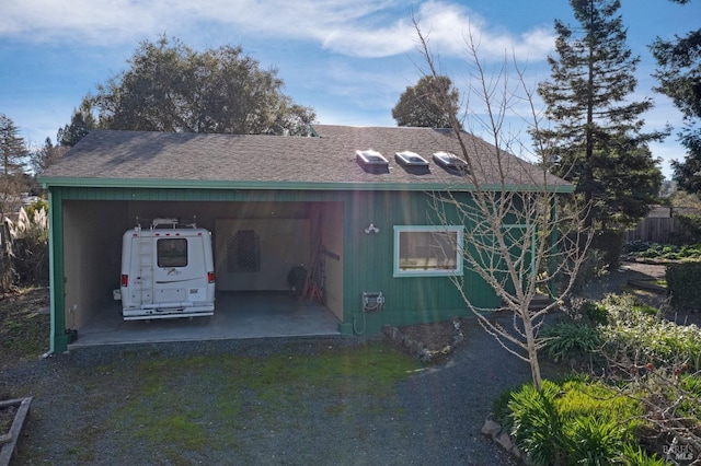 view of side of home with a carport