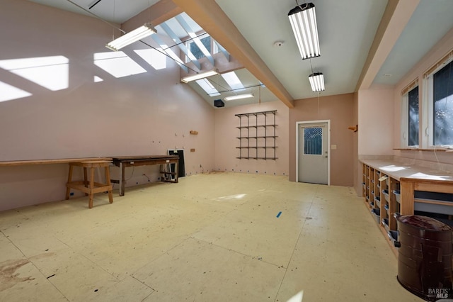 bonus room featuring lofted ceiling with beams