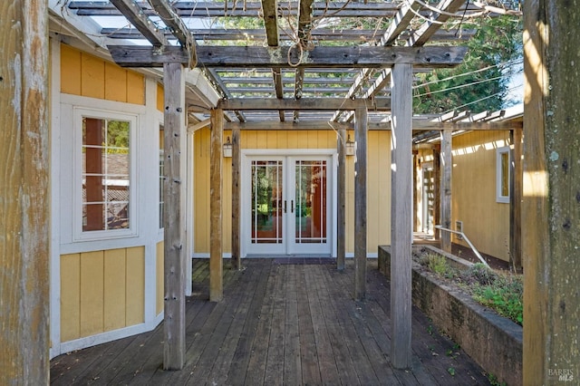 deck featuring french doors and a pergola