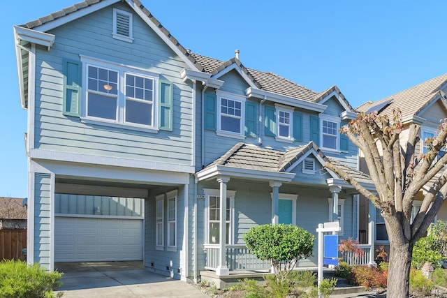 view of front of property with a garage and a porch