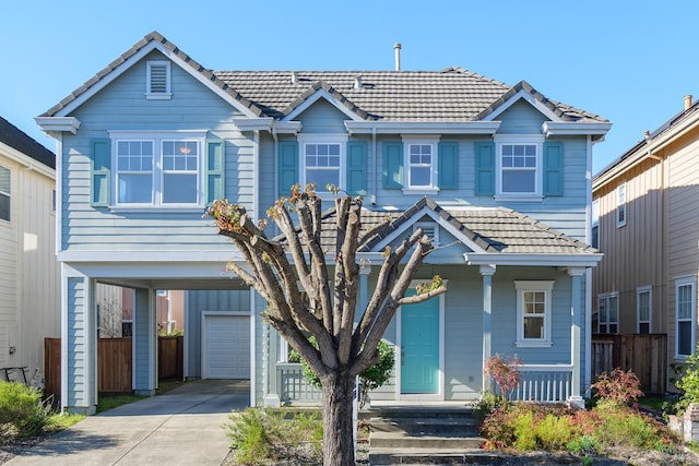 view of front of house featuring a garage and a carport