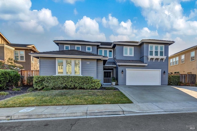 view of front of house with a garage and a front yard