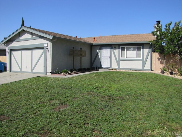 view of front of house with a garage and a front yard