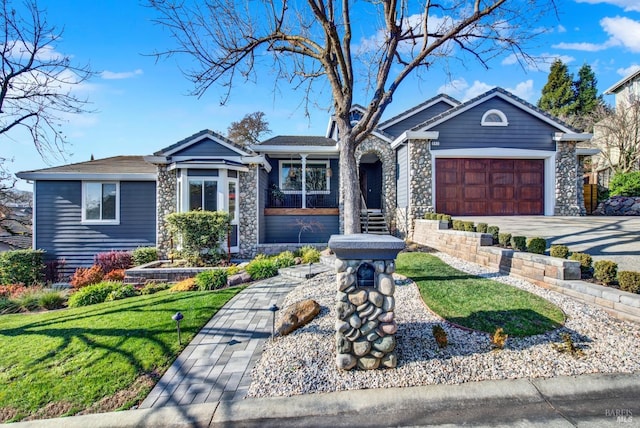 ranch-style home featuring a garage and a front lawn