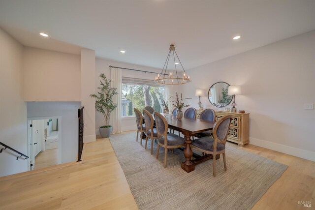 living room featuring crown molding and light hardwood / wood-style floors