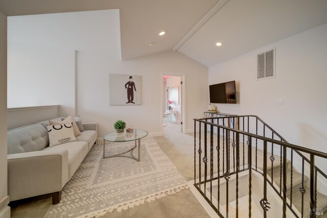 carpeted bedroom featuring lofted ceiling with beams and a chandelier