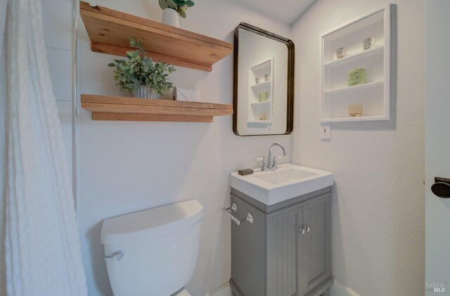 bathroom with tile patterned flooring and vanity