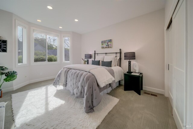 carpeted living room with lofted ceiling with beams