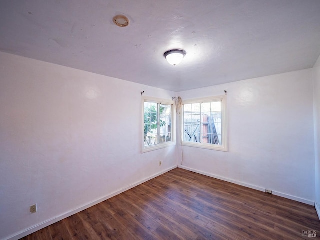 empty room featuring dark hardwood / wood-style floors