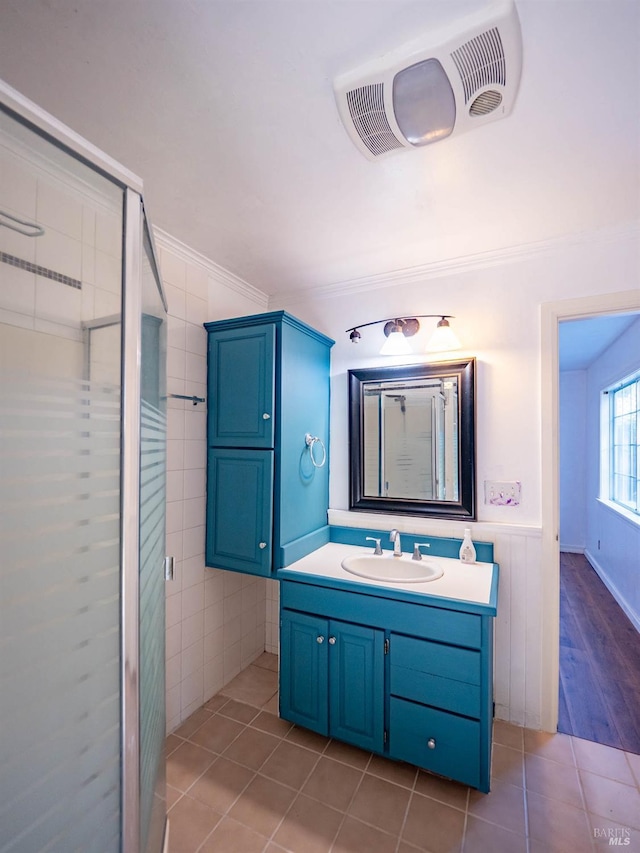 bathroom with ornamental molding, tile patterned floors, and vanity