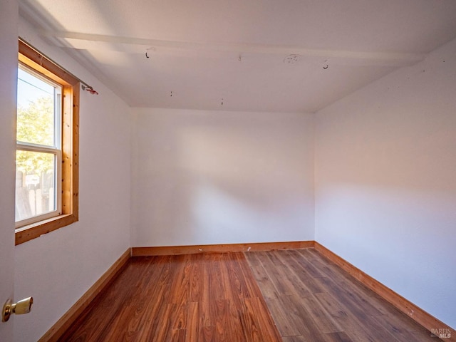 empty room with hardwood / wood-style flooring