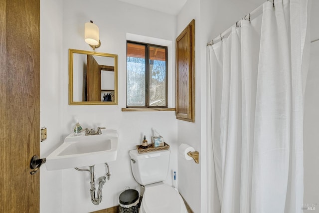 bathroom with toilet and sink