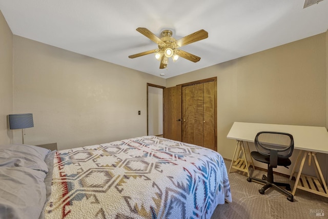 bedroom with ceiling fan, a closet, and carpet floors