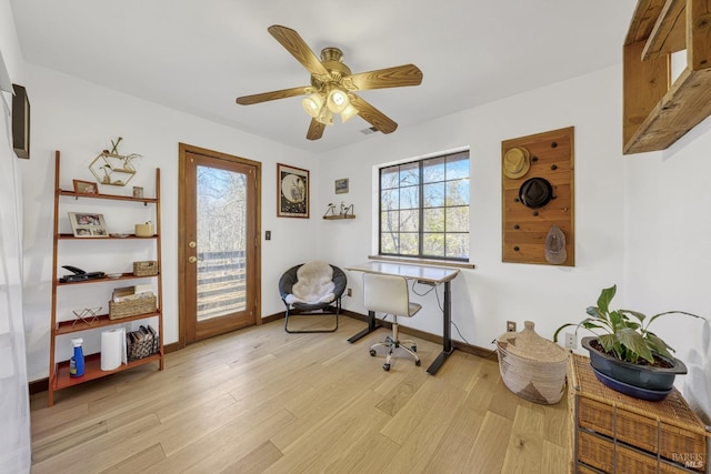 office area with light hardwood / wood-style floors and ceiling fan