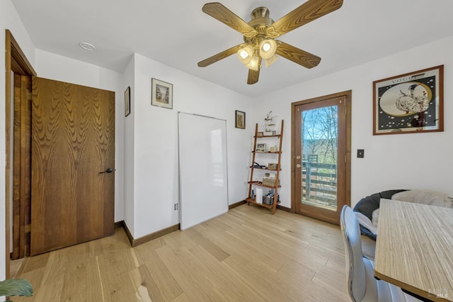 bedroom with ceiling fan and light wood-type flooring