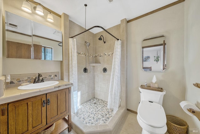 bathroom with walk in shower, vanity, backsplash, and tile patterned flooring