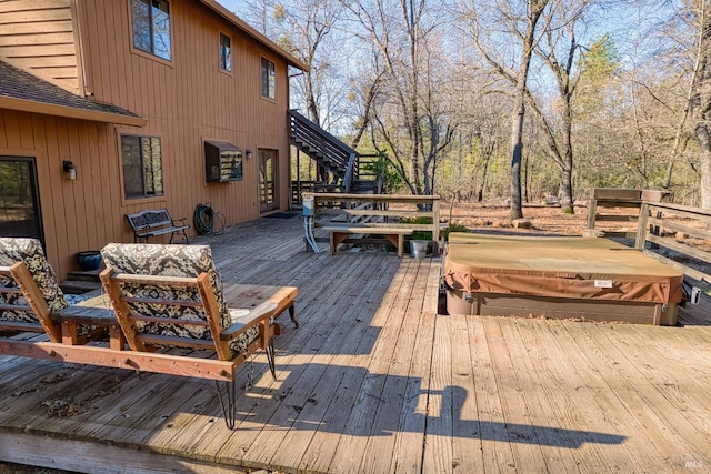 deck with a covered hot tub