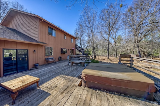 deck with a covered hot tub