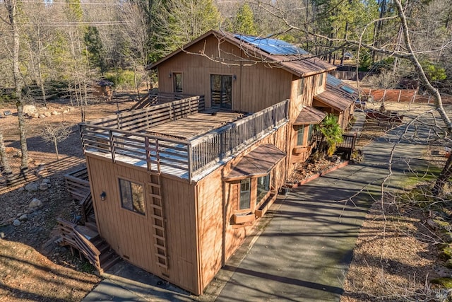 view of home's exterior featuring a deck