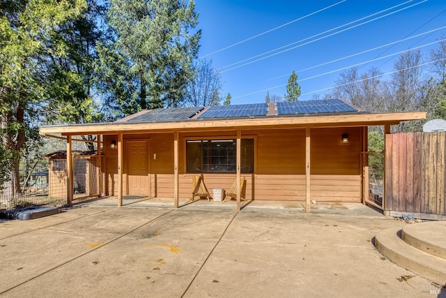 view of front of property with solar panels