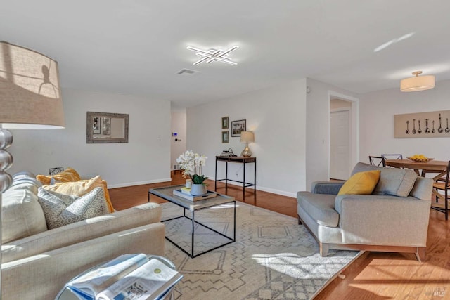 living room with light hardwood / wood-style flooring