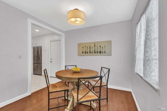 dining space featuring hardwood / wood-style floors