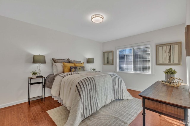 bedroom with hardwood / wood-style floors