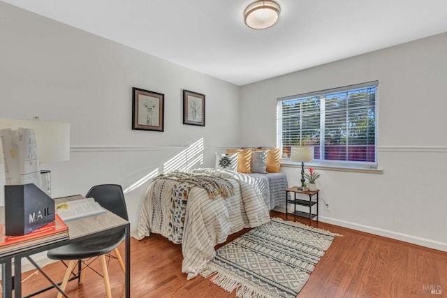 bedroom featuring wood-type flooring