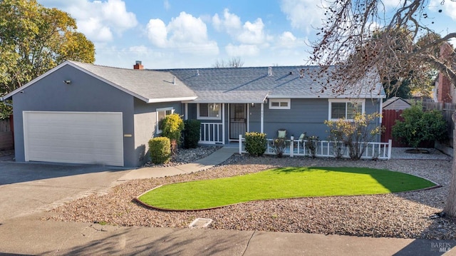 ranch-style house featuring a garage