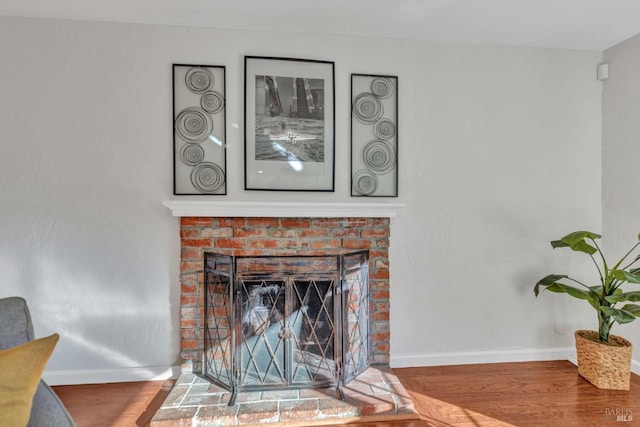 details featuring a fireplace and hardwood / wood-style flooring