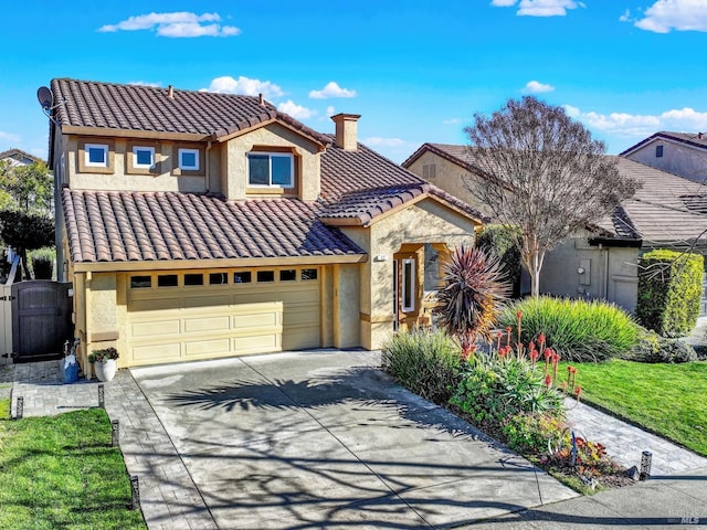 mediterranean / spanish house featuring a garage