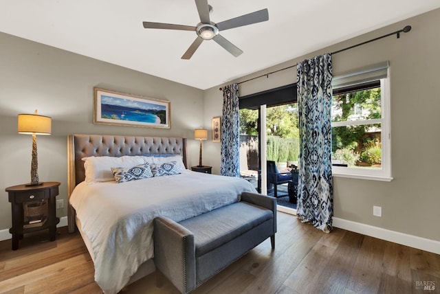 bedroom featuring wood-type flooring, access to outside, and ceiling fan