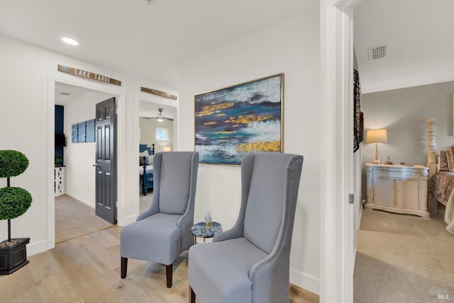 sitting room with light wood-type flooring